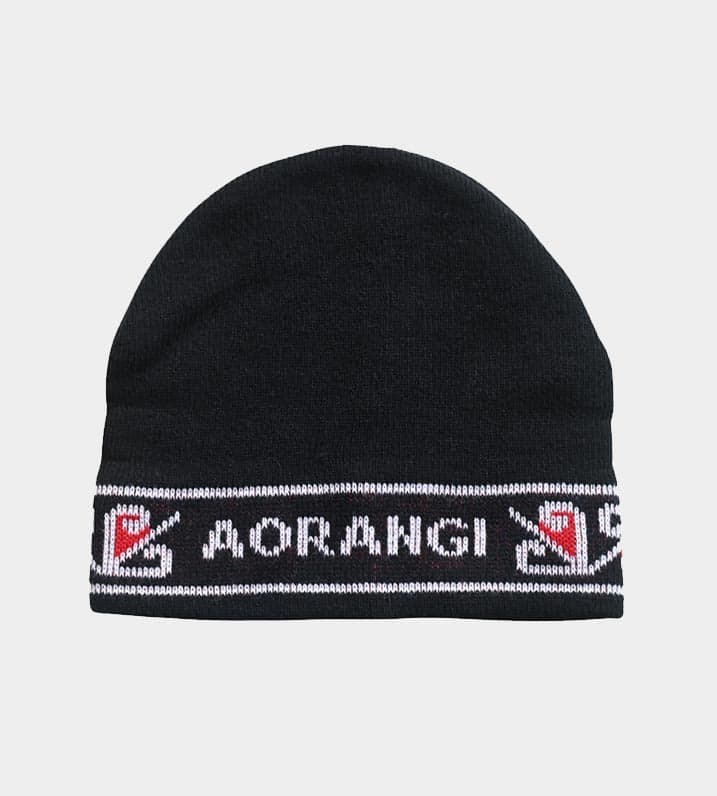 Black knitted Māori Iwi beanie with a white and red border pattern, and white lettering spelling "Aorangi" across the front.