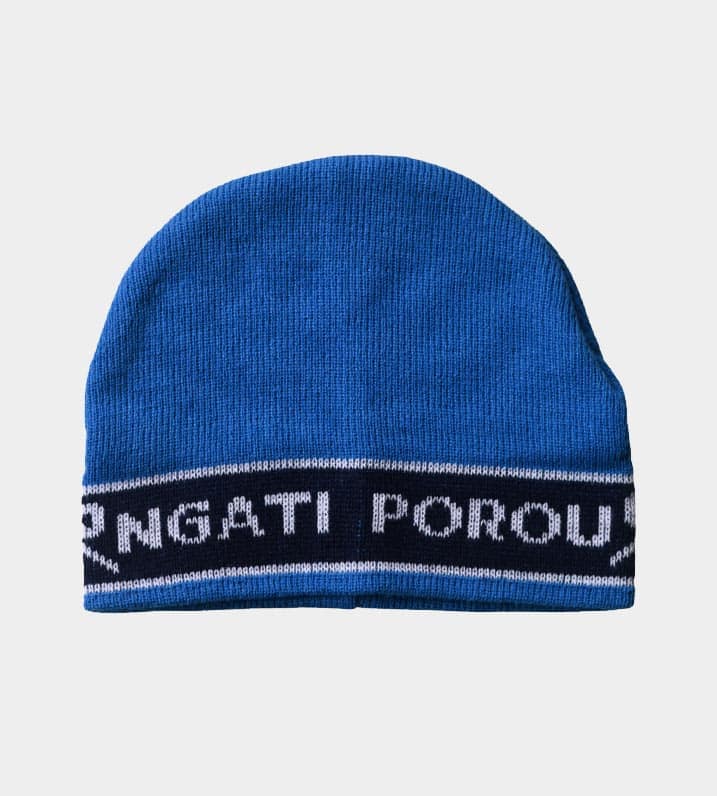 Blue knitted Māori Iwi beanie with a black and white border pattern, and white lettering spelling "Ngati Porou" across the front.